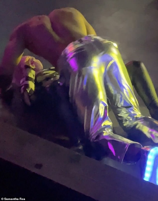 This PleasureBoys dancer is seen spinning on top of an audience member on the floor of the Birmingham venue.