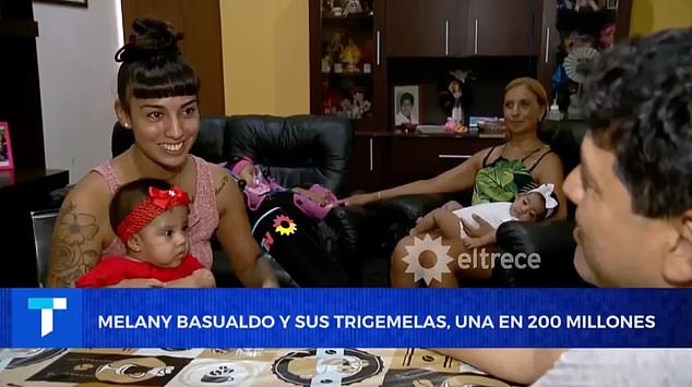 She revealed their births to a local news station.  Sitting in the background is her mother Marcela Frías who said that babies are the 'light of my life'