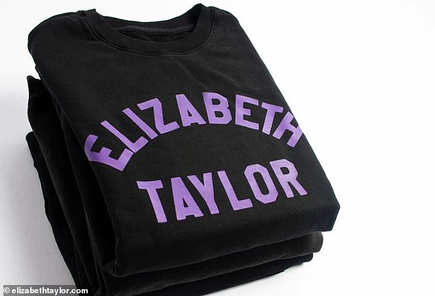 The black sweatshirt simply says Elilzabeth Taylor in purple letters on the front of the item.