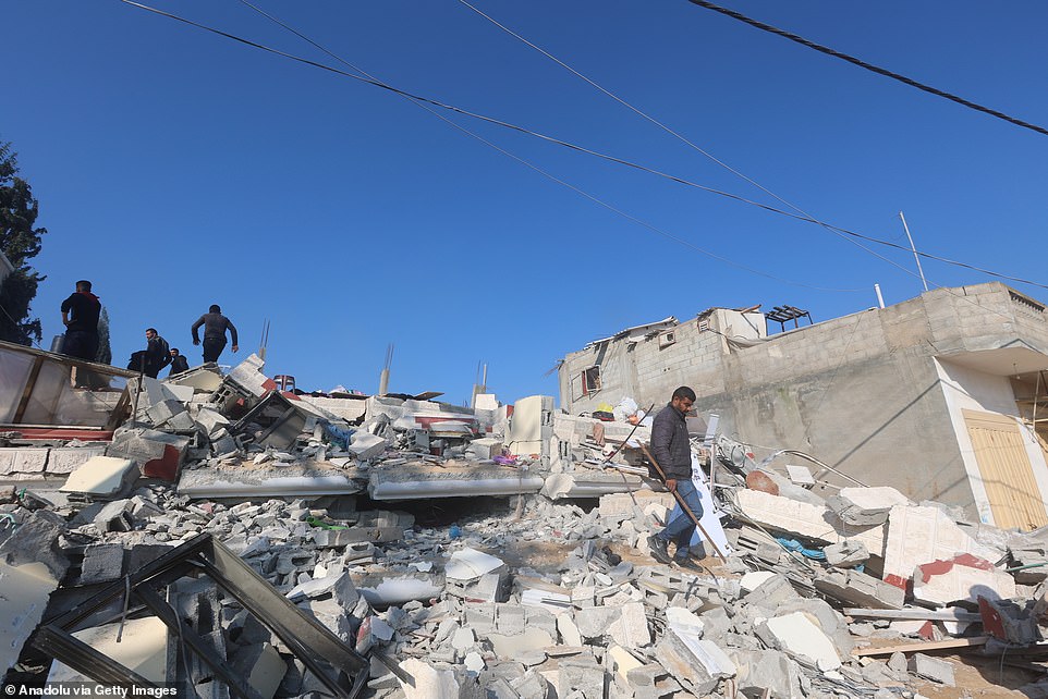 Search and rescue operations in the rubble of a collapsed building after an Israeli attack on Khan Yunis, Gaza, on February 26.