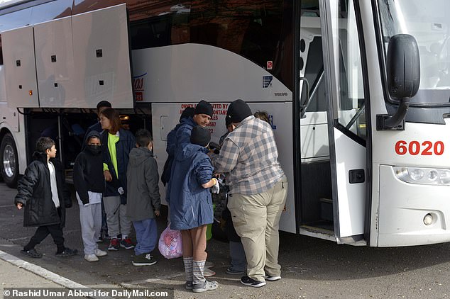 Migrants after being processed in El Paso, Texas, are loaded onto buses and sent to Denver, Colorado.