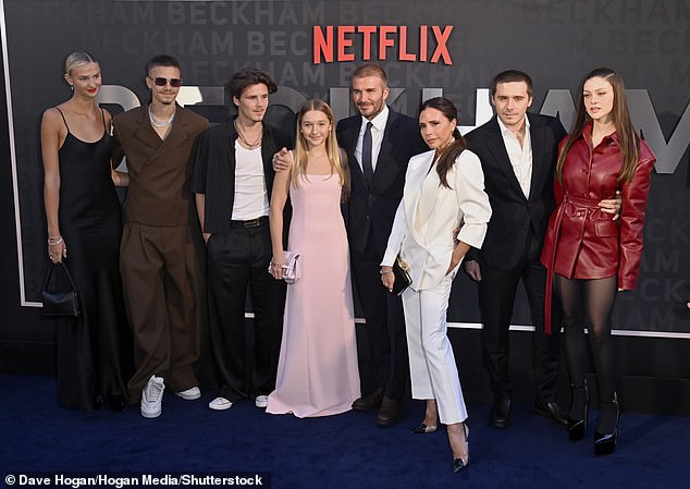 Former Spice Girl Victoria is said to have hopes of turning Brand Beckham into a Kardashian-style multi-million dollar empire (LR: Mia, Romeo, Cruz Beckham, Harper Beckham, David, Victoria, Brooklyn Beckham and Brooklyn's wife Nicola Peltz, in the photo October last year)
