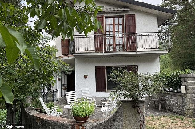 This stone property in Tuscany has four bedrooms and an attractive garden bordering a stream.