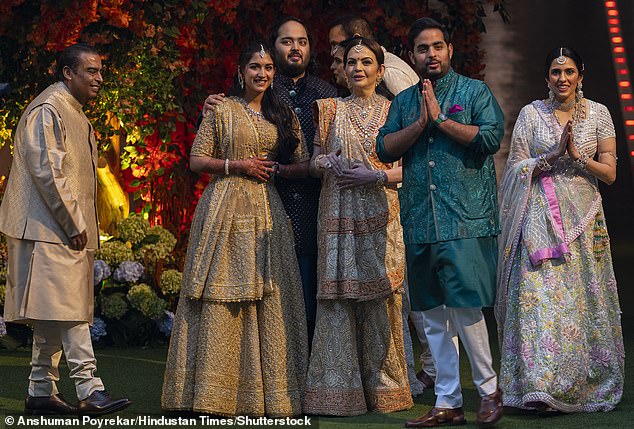 Anant Ambani and Radhika Merchant (centre) seen with the groom's family at their engagement ceremony.