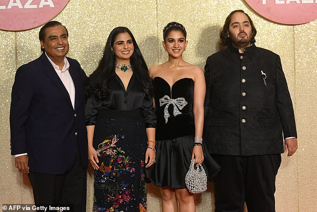 Indian billionaire businessman Mukesh Ambani (left) with his daughter Isha Ambani (2nd left), son Anant Ambani (right) and Radhika Merchant in October 2023.