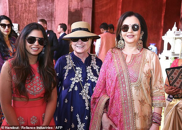 Celebrity friends: Hillary Clinton, center, with girlfriend Isha Ambani, left, and the bride's mother Nita on Sunday. Mrs Clinton reportedly stayed with the Ambanis during an earlier visit to Mumbai.