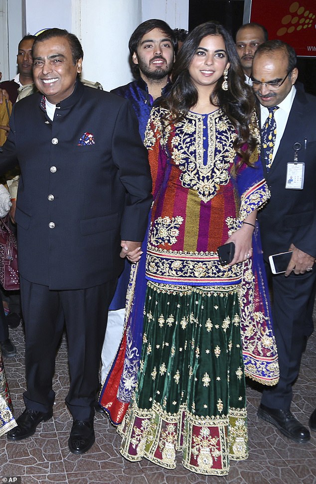 Mukesh Ambani, left, and his daughter Isha Ambani, arrive to attend the wedding of Bollywood actress Priyanka Chopra and Nick Jonas in November 2018.