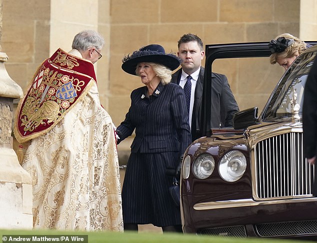 Queen Camilla is greeted today as she attends a service of thanksgiving for the life of King Constantine at St George's Chapel at Windsor Castle.