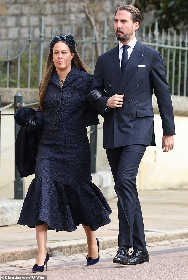 Crown Prince Pavlos' brother Philoppos and his wife Nina arrived arm in arm and dressed in navy blue.