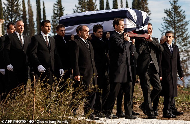 Pavlos, Crown Prince of Greece (center left) and Prince Nikolaos of Greece and Denmark (center right) carry the coffin of King Constantine II during a burial in Tatoi in 2023.