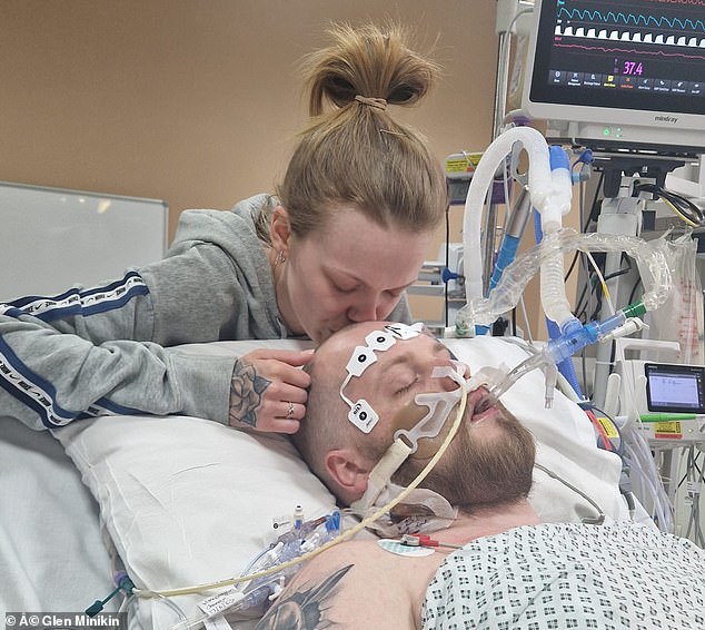 Doctors told her loved ones, including Ms Holmes (pictured kissing Mr Wilson), nine times that she would not survive over the course of her five-week coma.