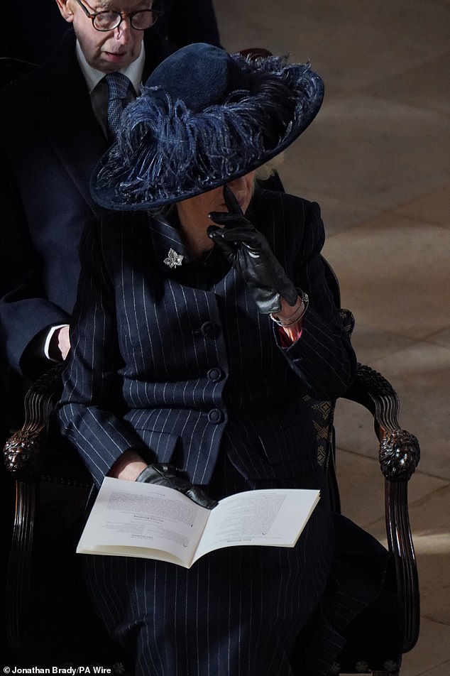 Queen Camilla wipes away a tear at the funeral for the life of King Constantine.