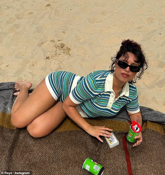 The singer, 26, who received a record seven nominations for the 2024 BRIT Awards, looked completely relaxed as she lay on a blanket on the beach.