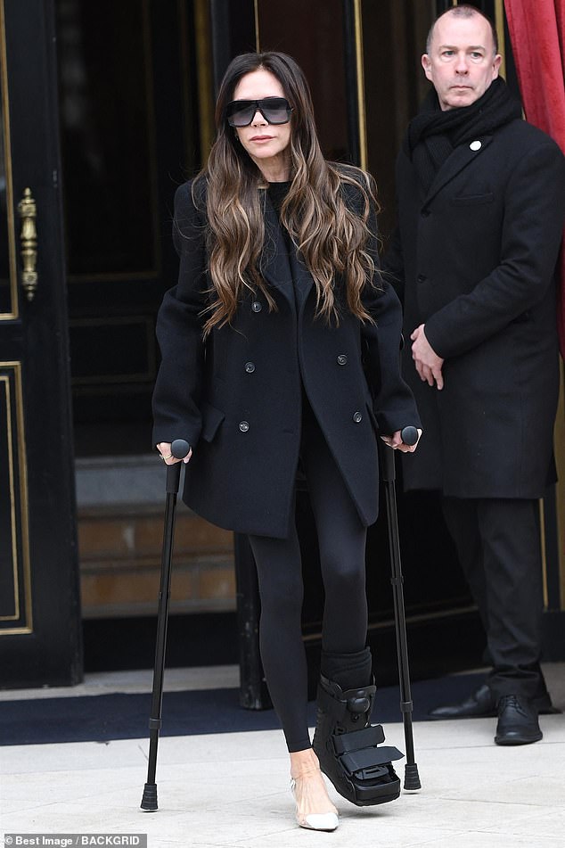 Elsewhere, Victoria limped out of her five-star hotel on crutches on Tuesday during Paris Fashion Week.