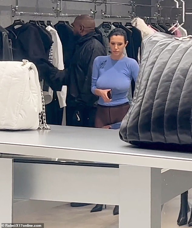 It's unclear if the rapper wore Nike sneakers to the shopping trip, but it appears to be the same pair he wore during the Marni fashion show on Friday.