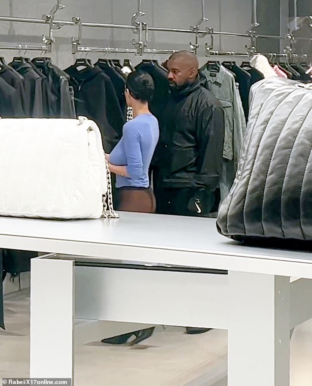 Meanwhile, Kanye wore a black hoodie with black and white sweatshirts and Nike gloves; The Nike detail was an interesting choice due to its ongoing dispute with Adidas.