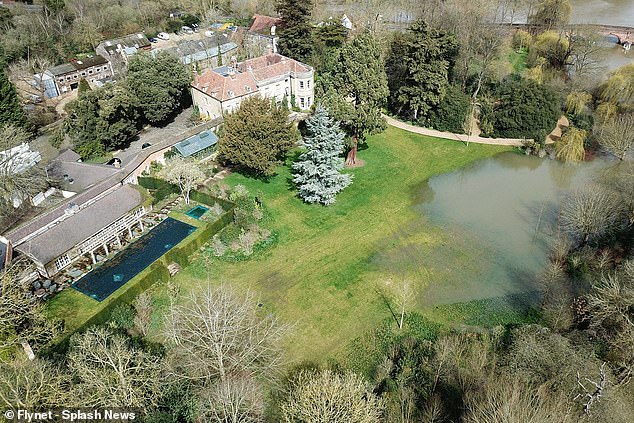 The Clooneys' home was hit by a flood in 2018, submerging the lawn