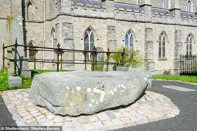 In Downpatrick, Lizzie visits St Patrick's tomb (pictured) at Down Cathedral