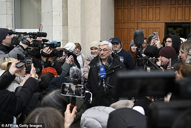 He was greeted by a crowd of journalists outside the courtroom during the hearing.