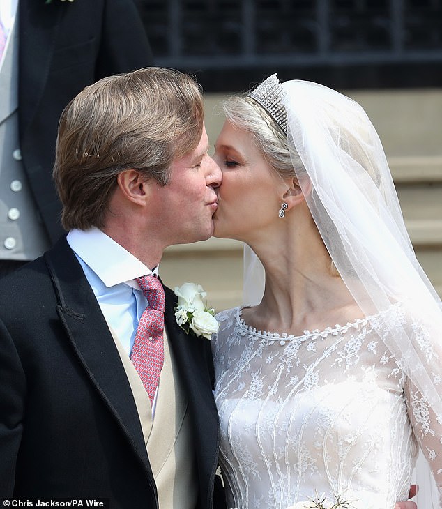 Thomas Kingston and Lady Gabriella Windsor kiss on the chapel steps after their wedding at St George's Chapel at Windsor Castle.