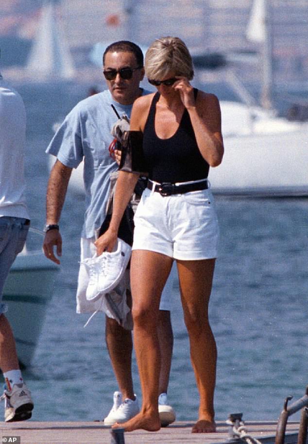 Diana, Princess of Wales (pictured, right) and her companion Dodi Fayed walk on a pontoon in the resort of St. Tropez on the French Riviera in 1997.