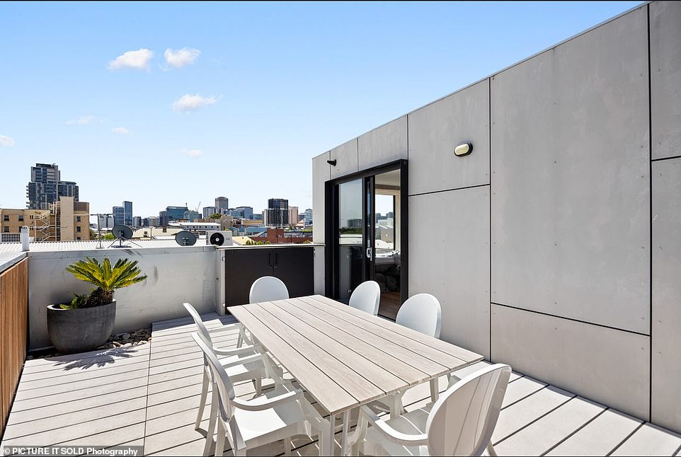 The contemporary four-storey house is located on a quiet residential street in the south-west corner of Adelaide's bustling central business district, on a small 90 square meter block.