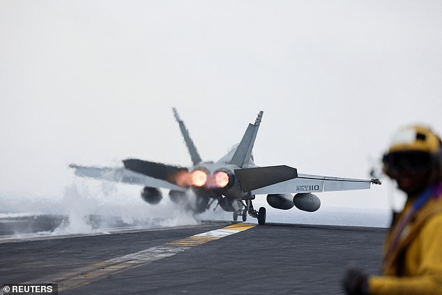 A US fighter jet is catapulted from the flight deck of a US aircraft carrier in the southern Red Sea.