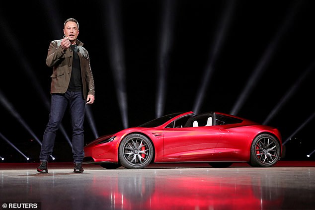 Tesla CEO Elon Musk pictured unveiling the Roadster 2 during a presentation in Hawthorne, California on November 16, 2017. He then said the first deliveries would arrive in 2020.