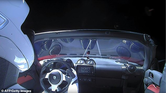 This still image taken from a SpaceX live video shows "star man" sitting in SpaceX CEO Elon Musk's cherry red Tesla roadster after the Falcon Heavy rocket