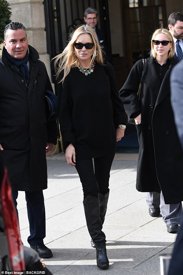 The style maven added height to her figure in a pair of knee-high black boots and also wore a statement multi-coloured necklace.