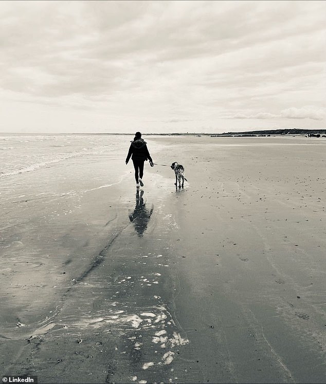 Accompanying her post, Daniella chose a black and white photograph of her walking her dog on the beach.
