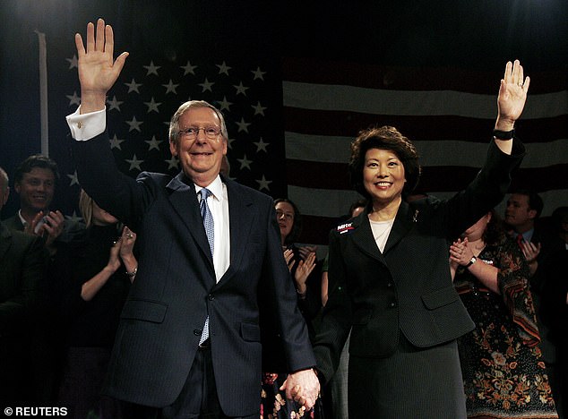 Mitch McConnell and his wife Elaine Chao greet supporters after his re-election to the Senate in 2004.