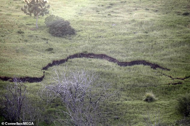 You can see a huge crack running through the hillside.