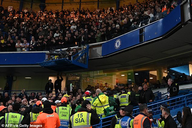 Fans applauded as the person was carried out of the stadium after his shocking accident in the first half.
