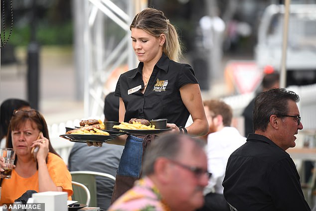 Employment website Seek found that those who found a new employer were 1.6 times more likely to get a raise, based on a survey of 1,200 people in 2023 (pictured, a Sydney waitress).