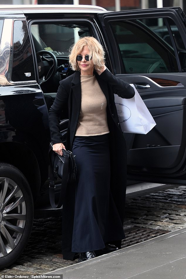 As she stepped out of a luxury SUV, the You've Got Mail star, 62, was seen carrying a large white Prada shopping bag.