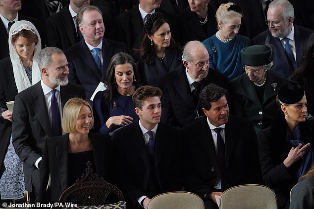Princess Olympia of Greece, Prince Achilles of Greece, Carlos Morales and Princess Tatiana of Greece sitting in front of the Spanish royal family in the chapel.