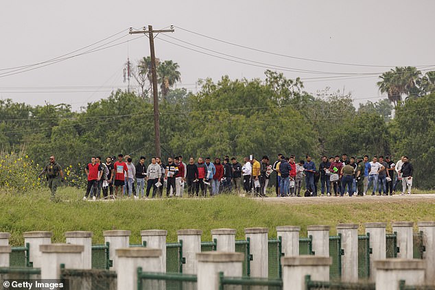 Last May, before the fence was installed, lines of immigrants waited at Camp Monument to be processed into the country.