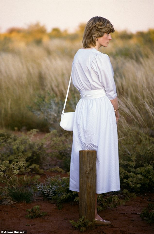 The exhibition shares several lesser-known images, such as this one of Diana wearing a casual white shirt for a visit to Ayers Rock during a royal tour of Australia in 1983.