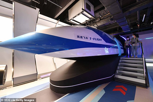 The T-Flight train reached a record speed of 600 km/h on a short test track, even faster than Japan's MLX01 Maglev, the world's fastest operating train (600 km/h). Pictured, a T-flight supersonic train model on display during an exhibition in Beijing, May 2023.