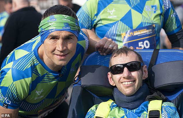 Rob was pushed around the course in his wheelchair, while Kevin ran the 26.2 miles and at the end