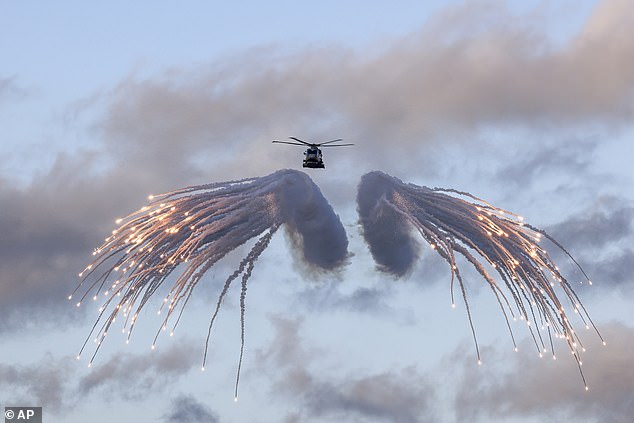 A Merlin helicopter from 820 Naval Air Squadron loaded and fired flares from HMS Prince of Wales, as it embarked for NATO's Steadfast Defender exercise.