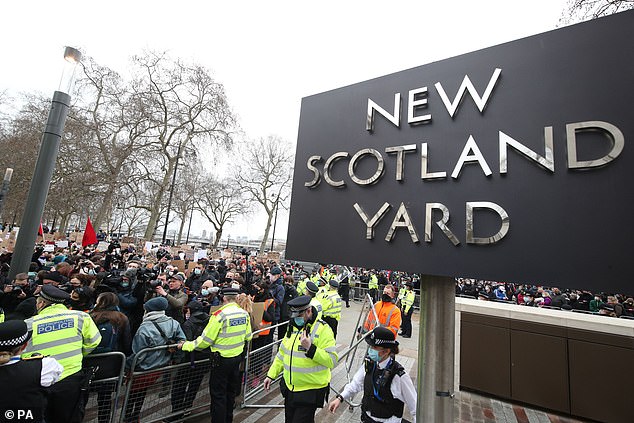 Crowds gather for a vigil to remember Sarah outside New Scotland Yard on March 14, 2021.
