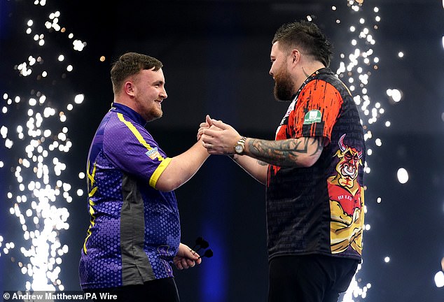 Littler beat Michael Smith (right), who beat him on the first night in Cardiff, in his first match of the night.