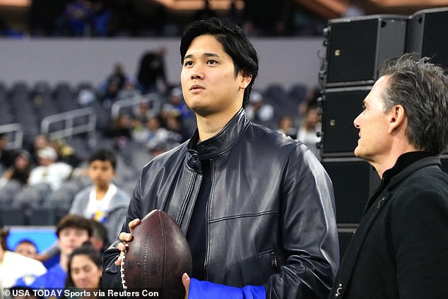 Ohtani and agent Nez Balelo attend an LA Rams game against the New Orleans Saints in December.
