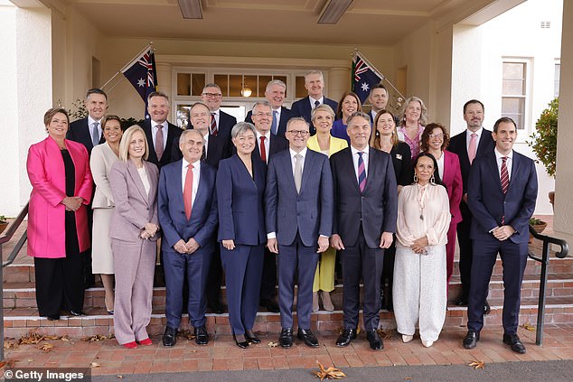 Prime Minister Anthony Albanese poses with his new ministry after a swearing-in ceremony at Government House.