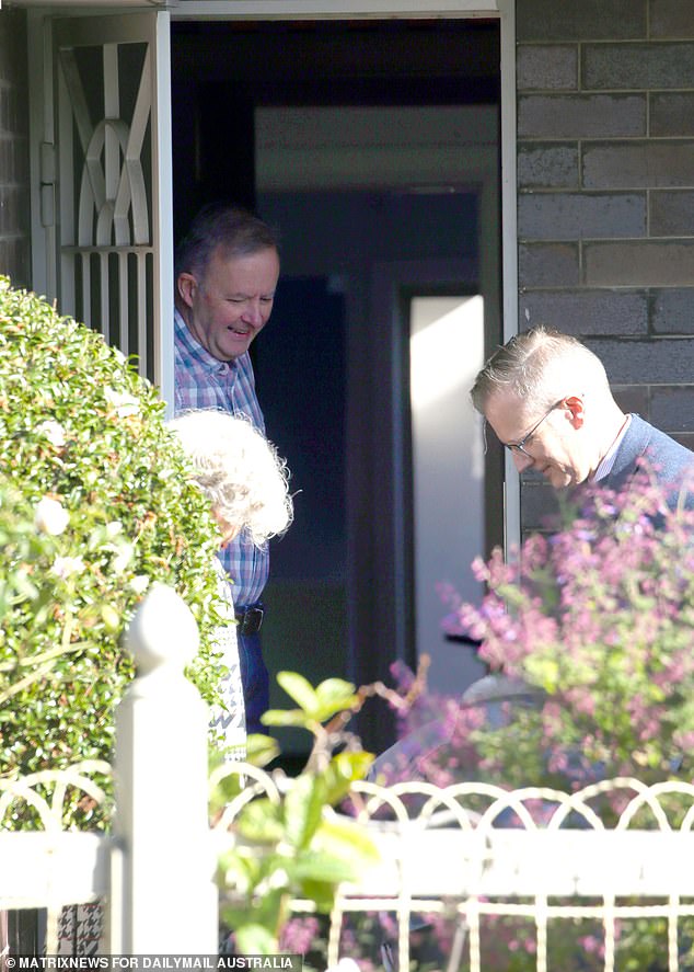 Anthony Albanese has swapped his pajamas for a flannel shirt and jeans to welcome potential members of his ministry and government officials to his home.