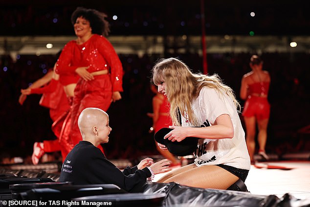Taylor Swift made a terminally ill nine-year-old girl's dream come true on Friday.  At the first of her Sydney shows on the Ages of Her tour, Swift chose young Scarlett, who is battling an aggressive form of brain cancer, to receive her signed '22' fedora (pictured) .