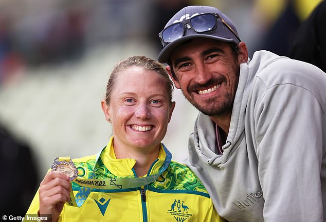 Australian cricket star Alyssa Healy (pictured with husband Mitchell Starc) showed her disdain towards a pitch invader while playing an overnight WPL T20 match in India.