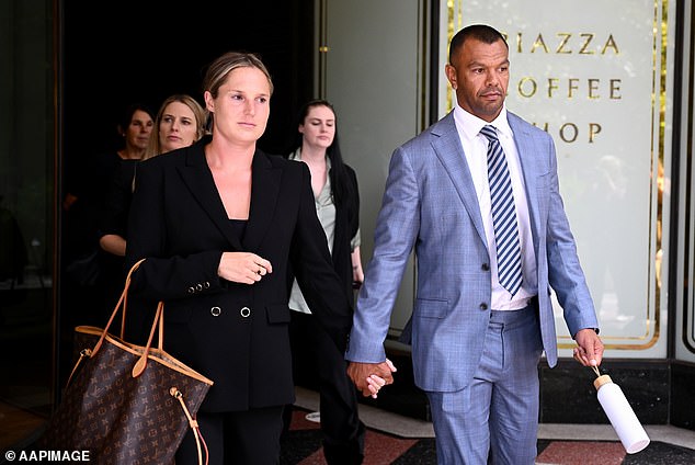 Kurtley Beale and his wife Maddi leave during a break in the proceedings at the Downing Center District Court in Sydney.